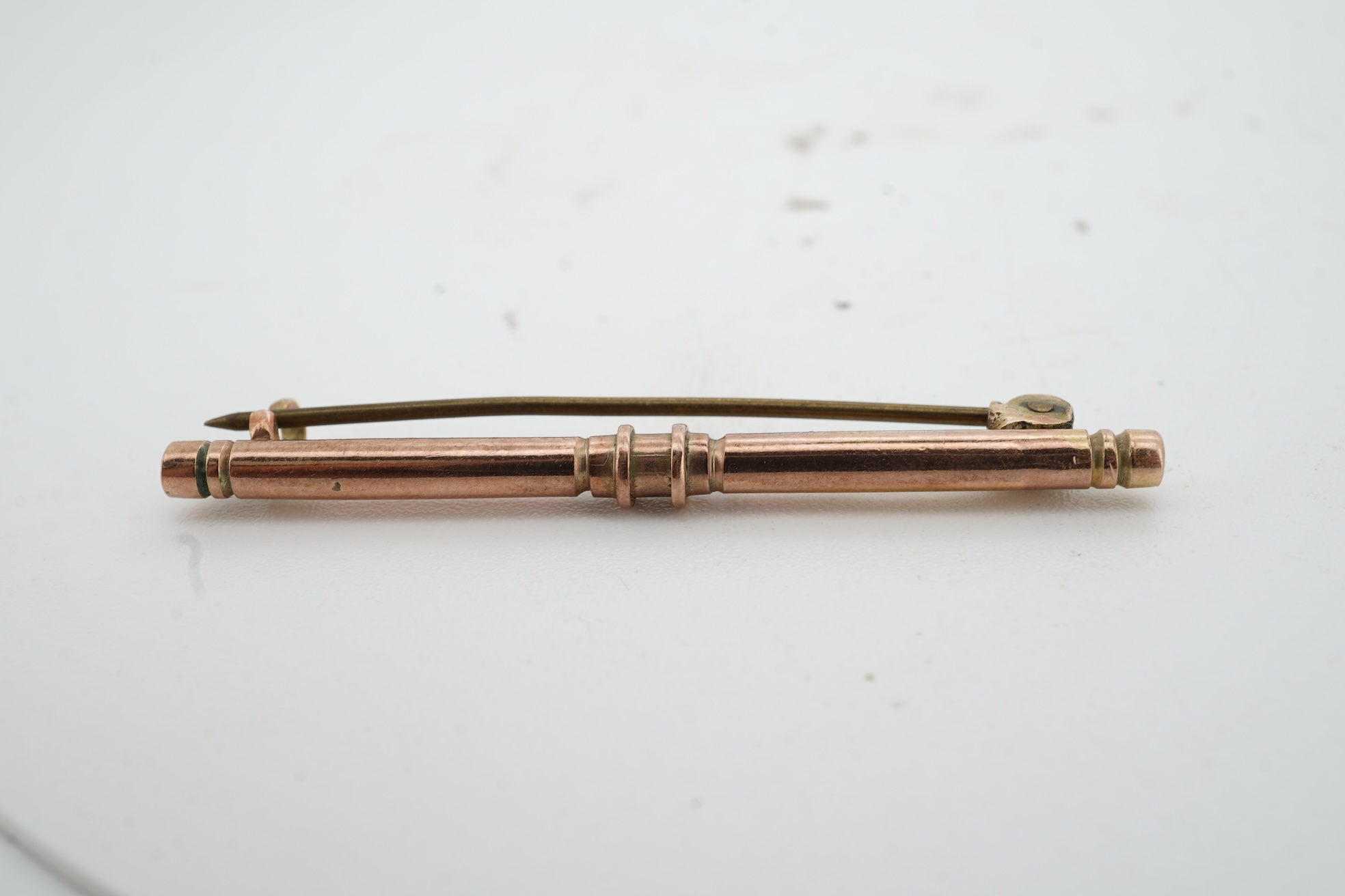 A pair of 18ct gold cufflinks, each end of oval outline, connected by chain linking, engraved with the initials RWA, length 1.8cm each, British hallmarks, combined gross weight approximately 7.5 grams